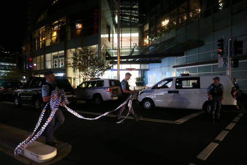 BONDI JUNCTION, AUSTRALIA - APRIL 13: NSW police prepare to cordon off an area outside Westfield Bondi Junction on April 13, 2024 in Bondi Junction, Australia. Six victims, plus the offender, are confirmed dead following an incident at Westfield Shopping Centre in Bondi Junction, Sydney. (Photo by Lisa Maree Williams/Getty Images)