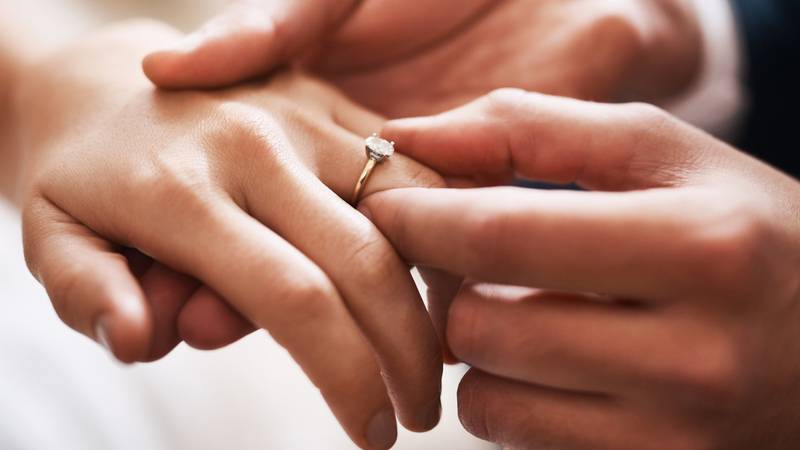 Two officers in Eau Claire, Wisconsin helped a man propose to his girlfriend by setting up a staged traffic stop last weekend. What appeared to be a routine traffic stop ended up with a ring over handcuffs.