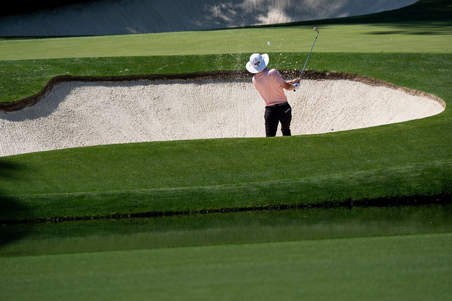 Golfer in a sand trap at The Masters.